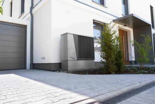 Heat pump installed beside a contemporary home